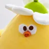 A cute yellow chick doll with white flowers on its head, green stems for decoration, orange PAWS and a white plush background is a children's gift Application Scenario